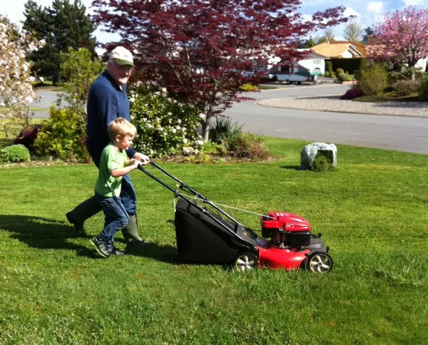 Young Matthew mowing